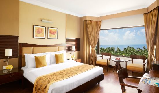 alt-text a double bed in a hotel room with a picturesque view 089