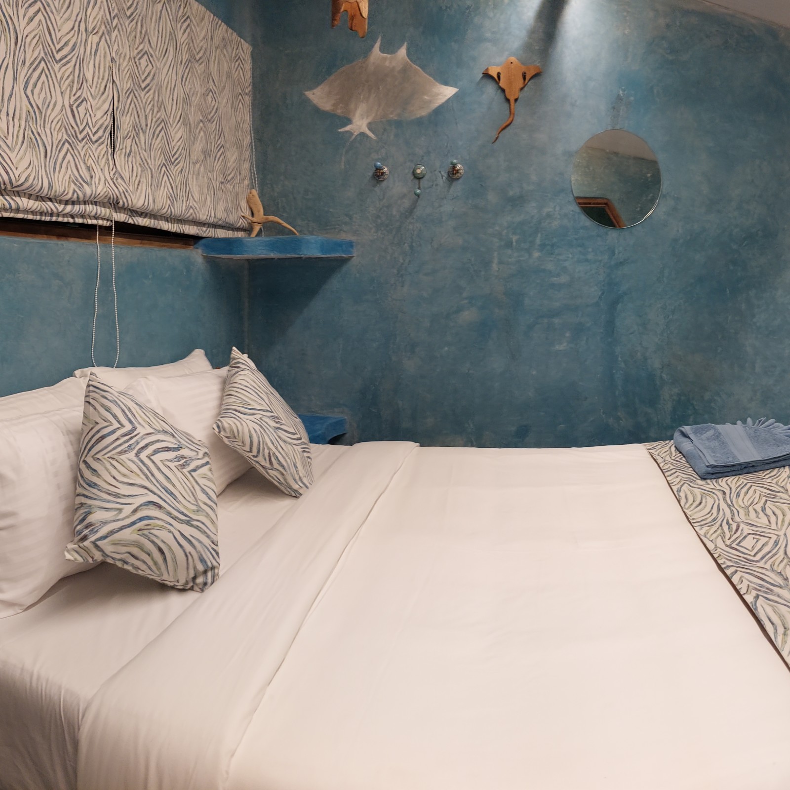 A bed with bedding | Matsya Island Retreat