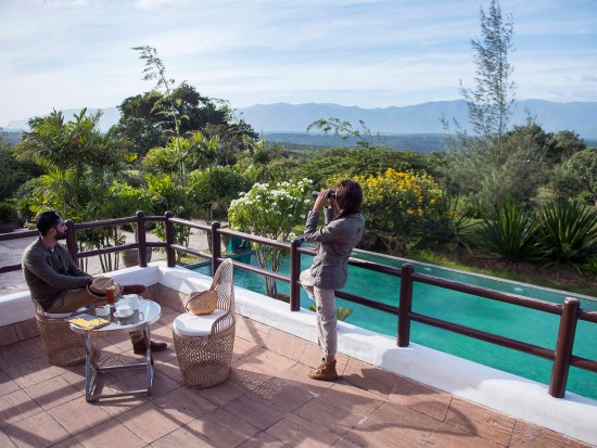 people admiring the view from a deck at our resort in Bandipur