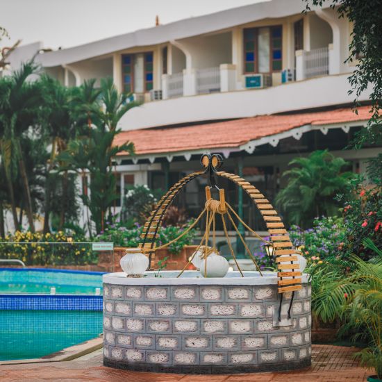 a decorated well near the swimming pool