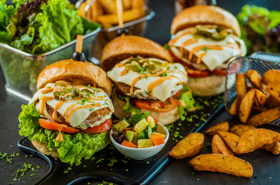 alt-text three mini burgers with potato wedges - polo floatel kolkata