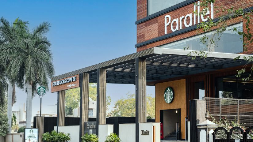 Entrance gate with wooden pillars at Parallel Hotel, Udaipur