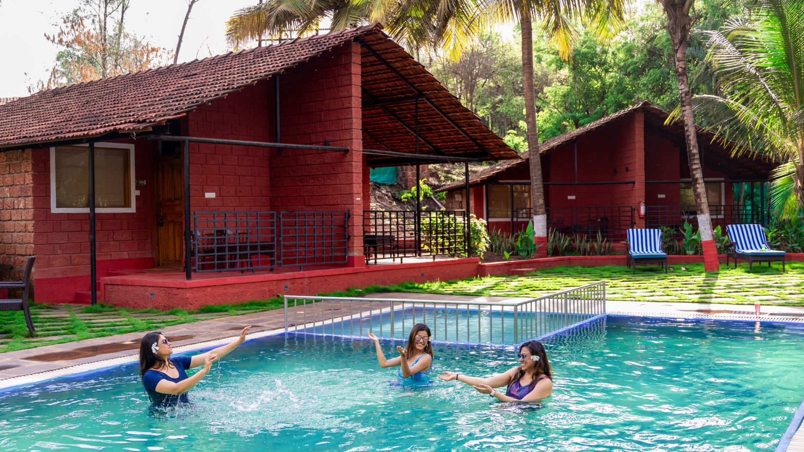 women playing in the swimming pool at Lotus Eco Beach Resort