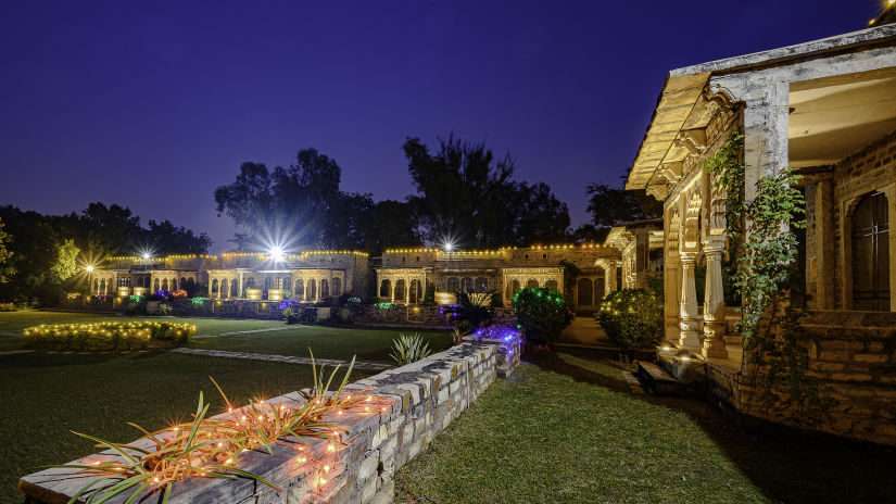 Deo Bagh - 17th Century, Gwalior - the lawn and garden area of the resort in Gwalior during night time