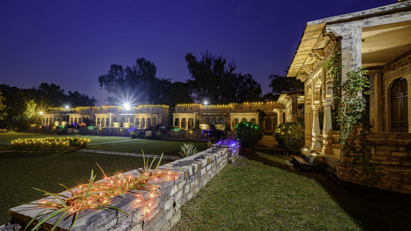 Deo Bagh - 17th Century, Gwalior - the lawn and garden area of the resort in Gwalior during night time