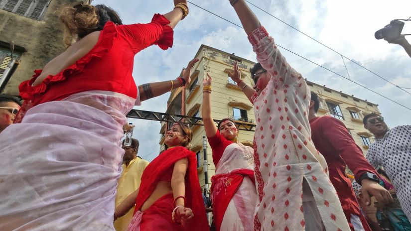 a shot of women dancing in Bihu