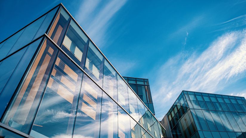 Two buildings in view with the sky in the background