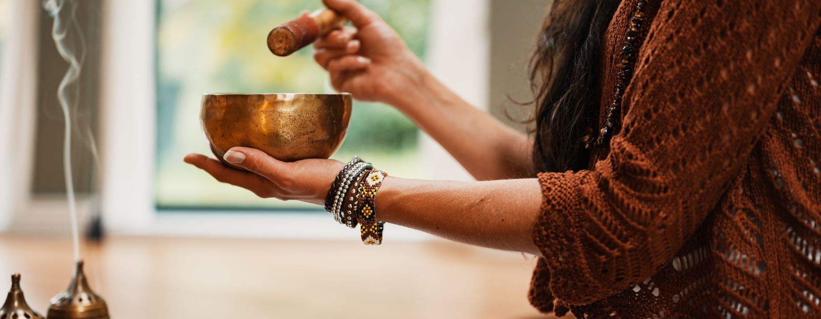 a person using a tibetan singing bowl