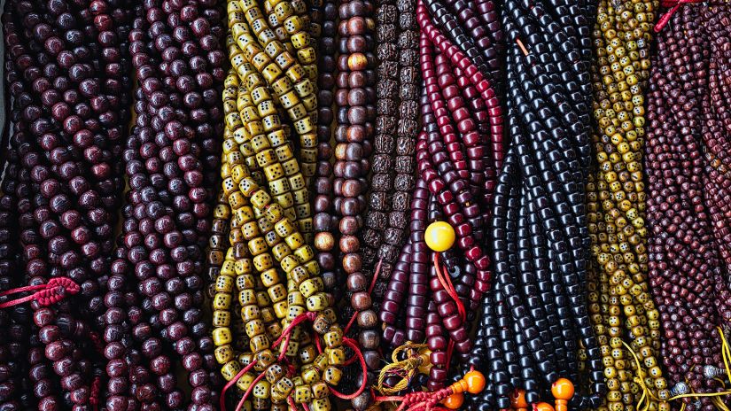 A bunch of prayer beads made of numerous colourful beads of varying lengths