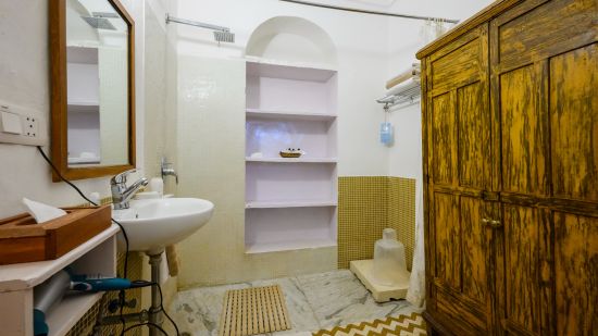 Hill Fort Kesroli 14th Century Alwar - Image of the Swagat Mahal bathroom featuring a wash basin and a mirror