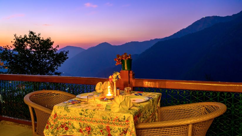 Night view of outdoor tea set-up overlooking the valley at The Ramgarh Bungalows - 19th Century, Above Nainital