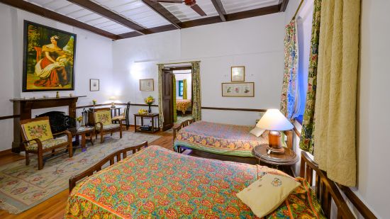 The Ramgarh Bungalows - Kashmir room with a fireplace and double bed for a comfortable stay