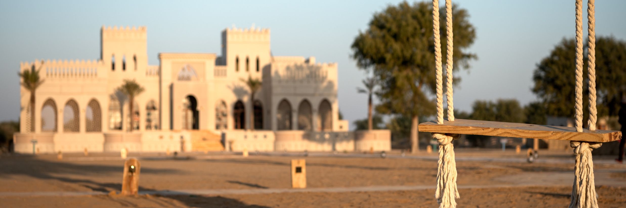 A swing with the hotel at the background - Karwaan Jaisalmer