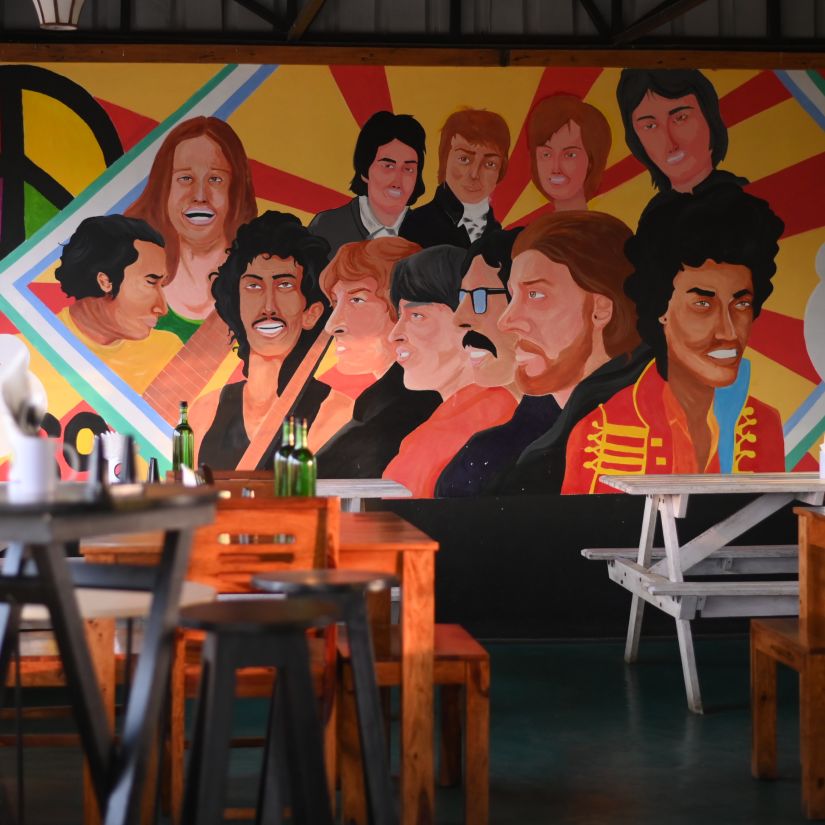 Café with vibrant mural wall