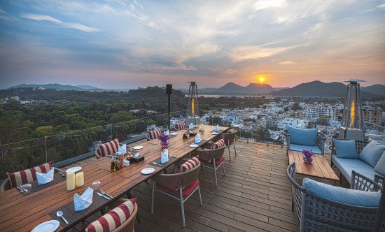 alt-text Seating arrangements on rooftop at Parallel Hotel, Udaipur