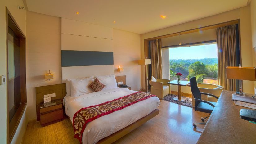 interiors of the deluxe room at narayani heights 1