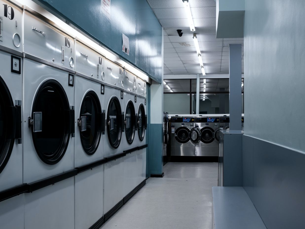 Image of multiple washing mchines lined up