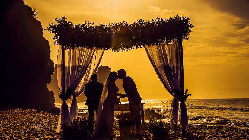 bride and groom kissing at their wedding ceremony