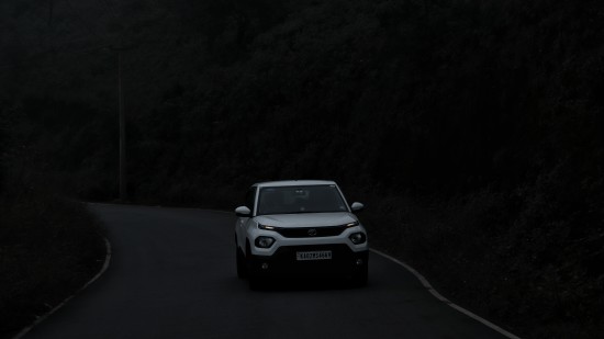 a car driving on a road at night