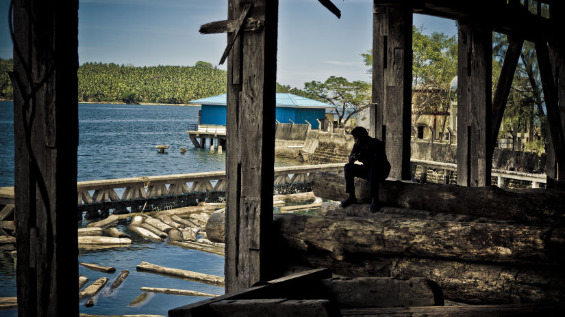 A view of beach from underneath a bridge during a day | Barefoot at Havelock