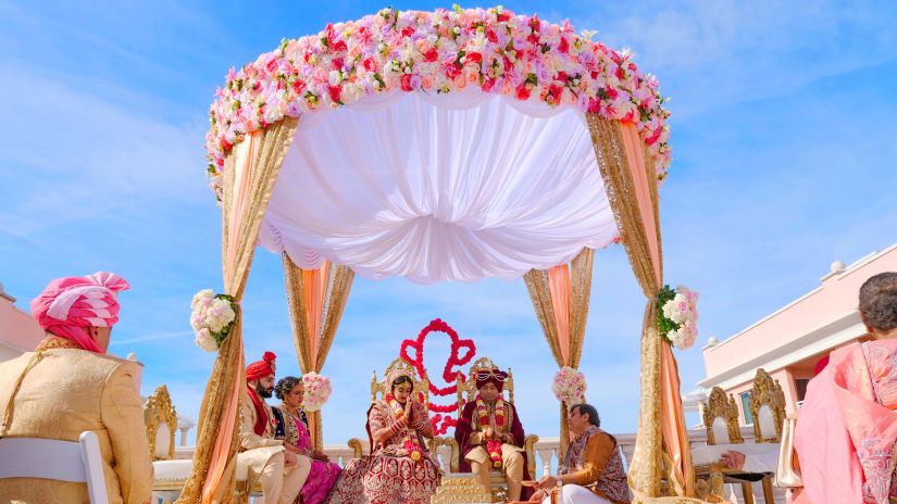 a scenic wedding in south goa - a hindu couple sitting at the mandap