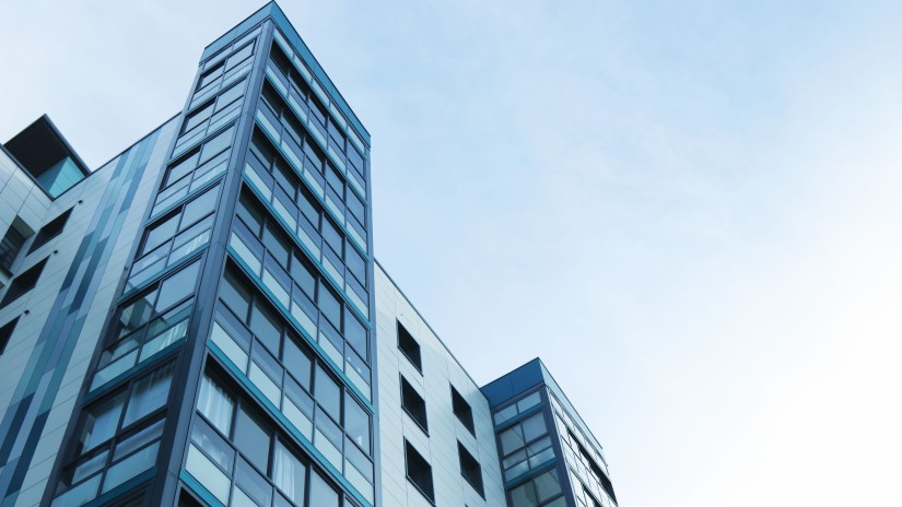 side view of sky rise buildings with blue sky in the background