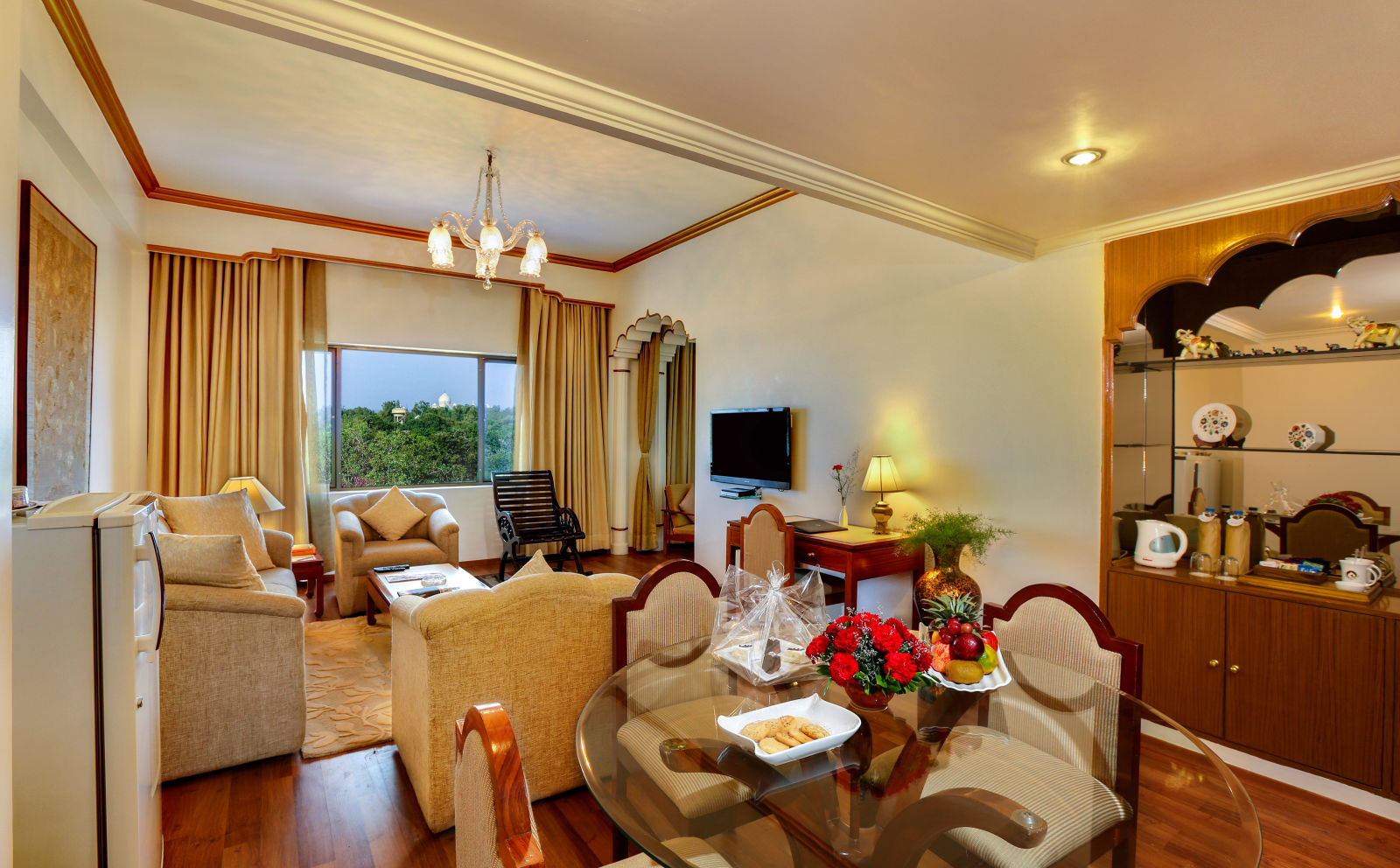 The Mumtaz Suite living area with a sofa and a dining table