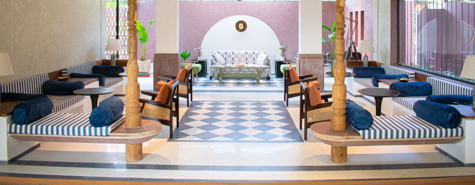 Inside view of waiting area with seating tables at The Sierra