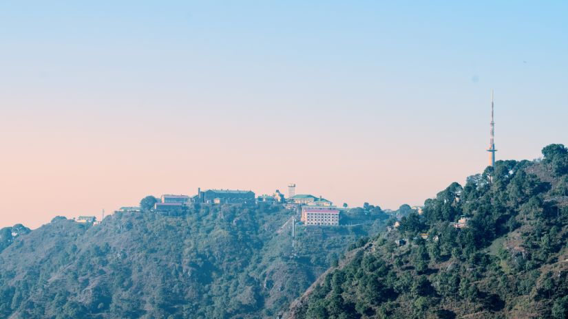 view of the sun setting behind the hills of Kasauli