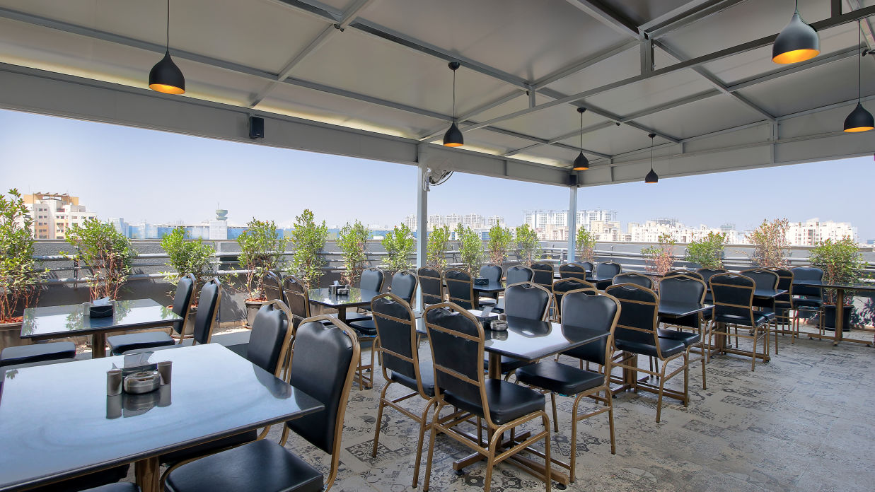 Seating arrangement inside the Restaurant in the morning - Magnus Fortune House, Magarpatta 1