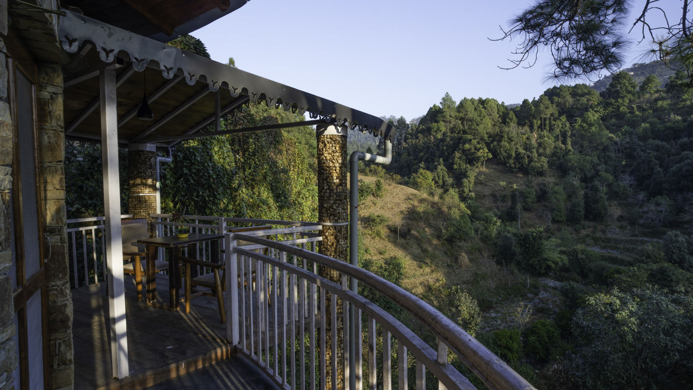 A balcony opening up to scenic mountain views - The Nature's Green Resort, Bhimtal