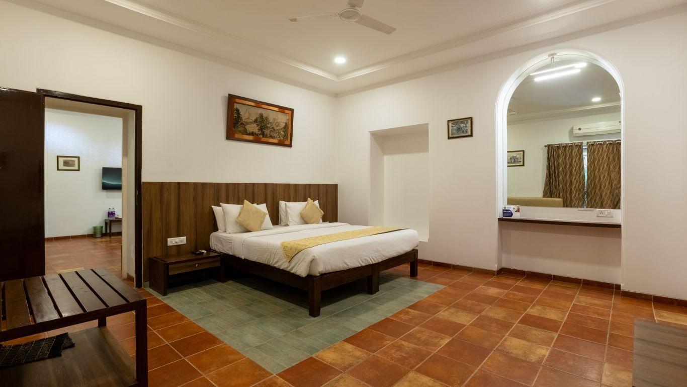 Picture showing the King size bed in the Vintage interconnecting Room, at ZARA’s Resort, Khandala