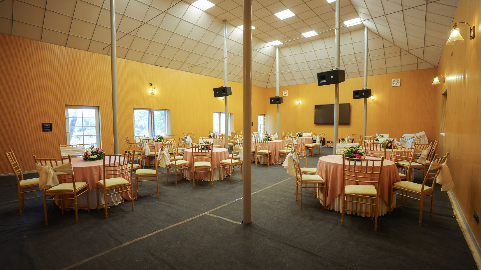 Seating arrangements under the canopy at The Carp, Capitol Village Resort, Madikeri