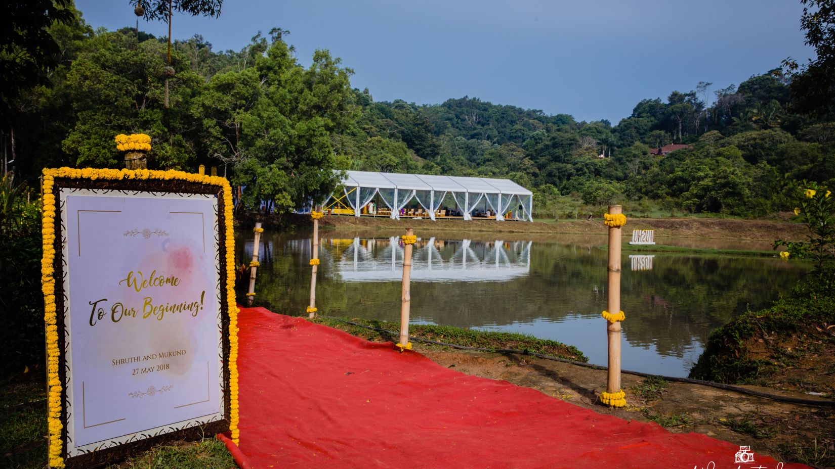 Wedding Decor with red mat on the pathway at The Lakeside, Capitol Village Resort, Madikeri