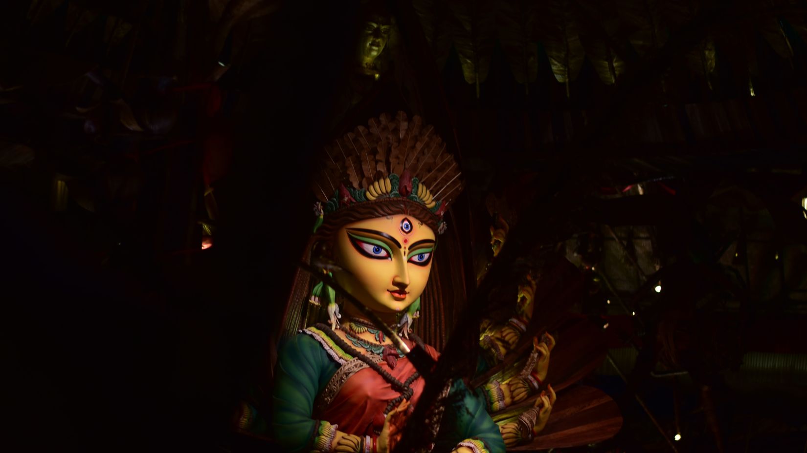 an idol of goddess durga captured with a shadowy background