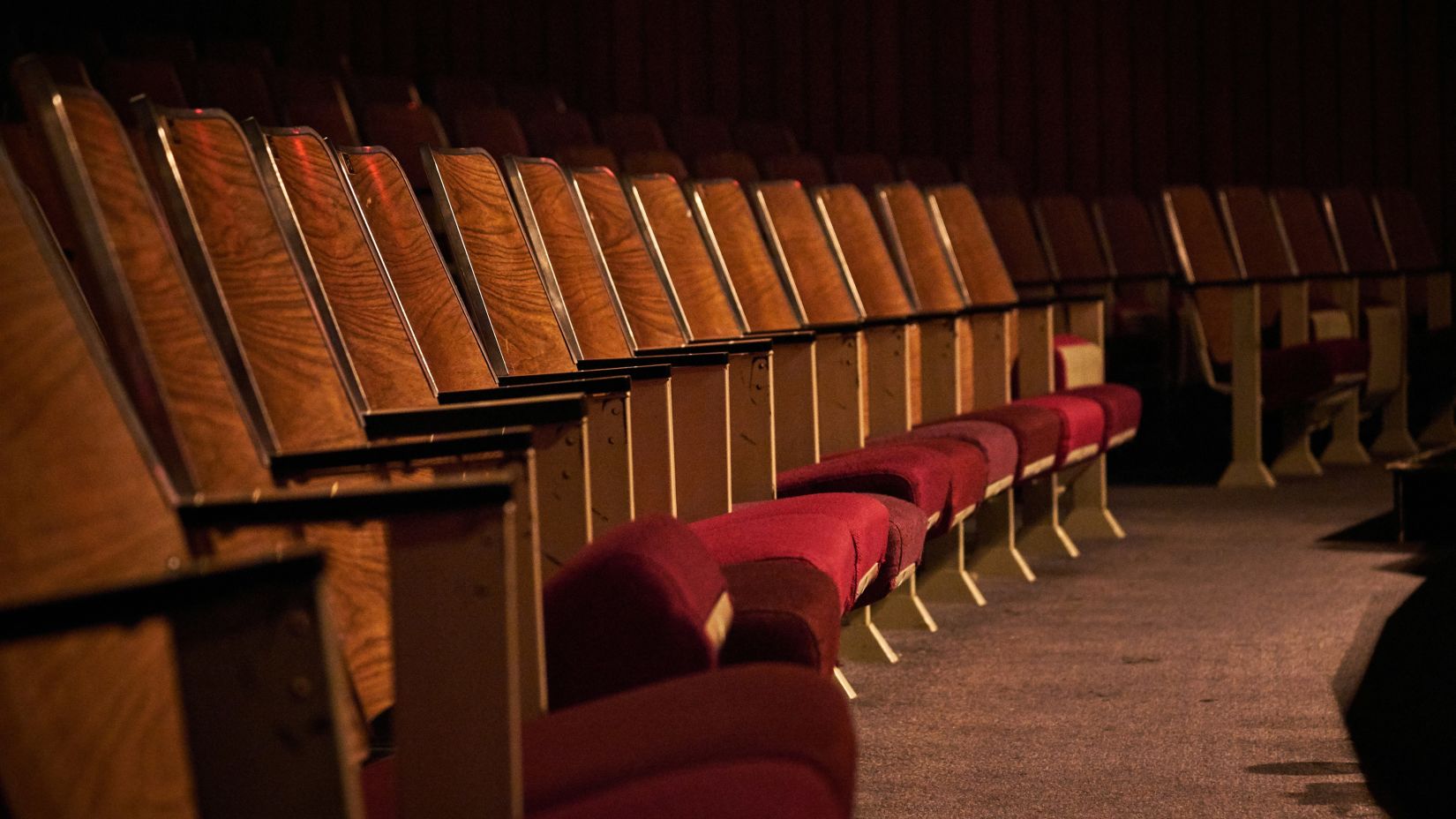 Image of chairs arranged in a theatre 