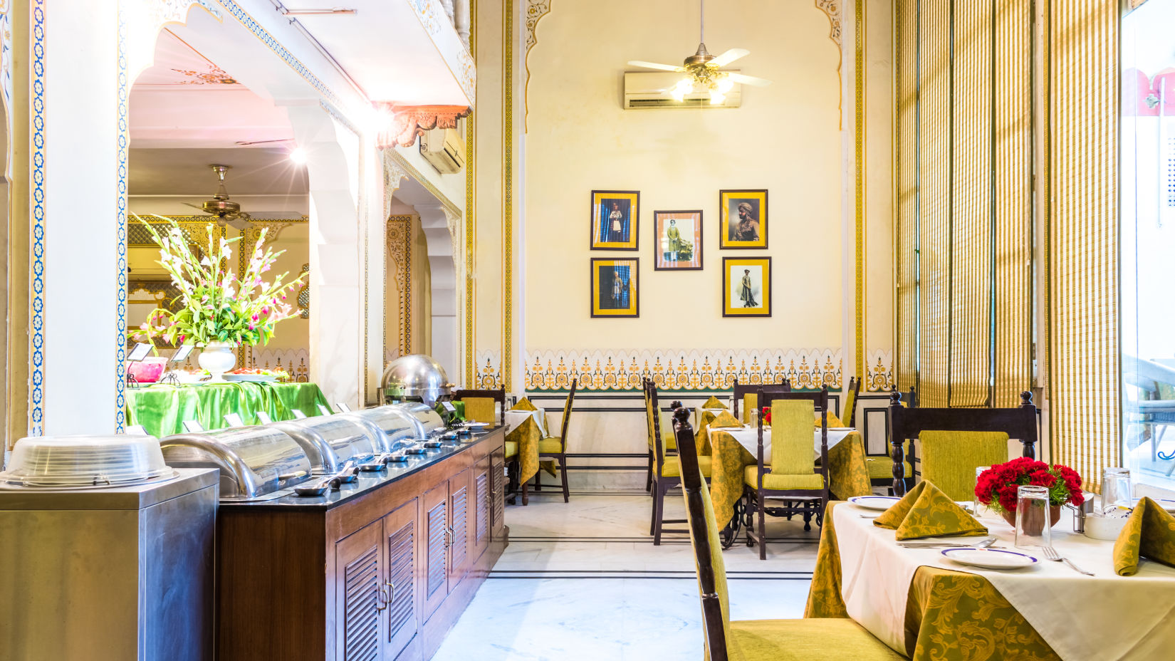 Side view of the Buffet counter next to seating arrangements at Hari Mahal - Mandawa Haveli, Jaipur