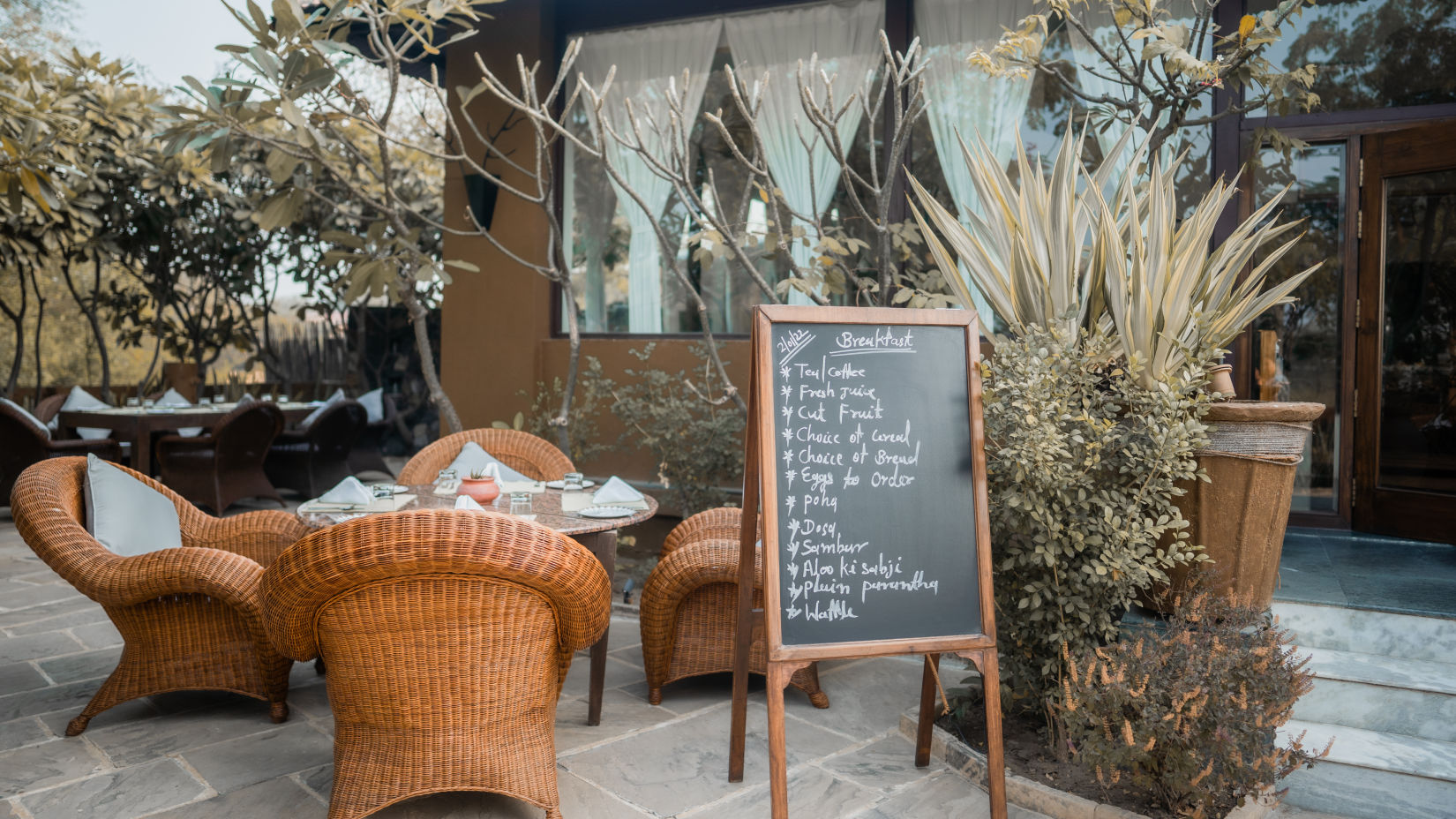 The Blackbuck Lodge - restaurant area at our lodge with indoor and outdoor seating