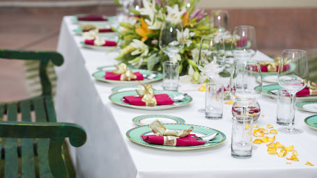 Dining table set up at an event in Manesar