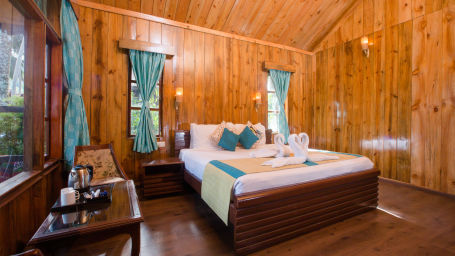 bedroom with wooden interiors in Lagoon Suite 6