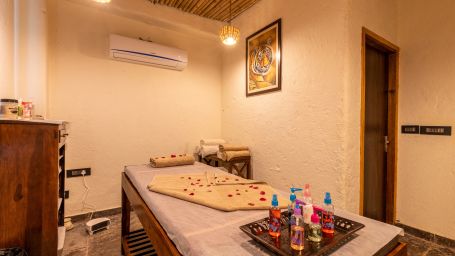 aromatic oils kept on a spa bed at the spa in Ranthambore at The Baagh Ananta Elite