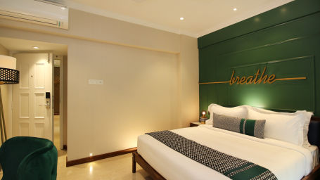 rooms with a king bed and modern interiors at theory9 bandra