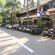 Outer view of Facade of Hotel Shivam, Pune featuring a parking area