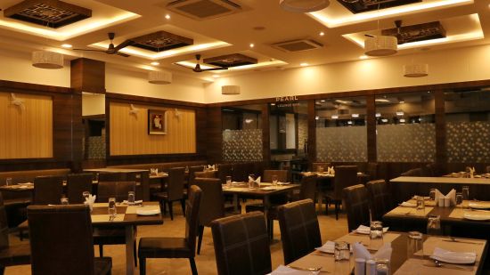 side view of restaurant adorned in plethora of colours - Click Hotel - Sagar Plaza , Chakan Pune