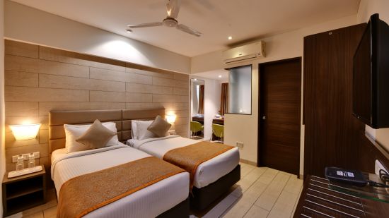 Twin beds inside the twin room at Click hotel Vadodara