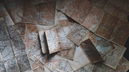 Numerous maps on a table