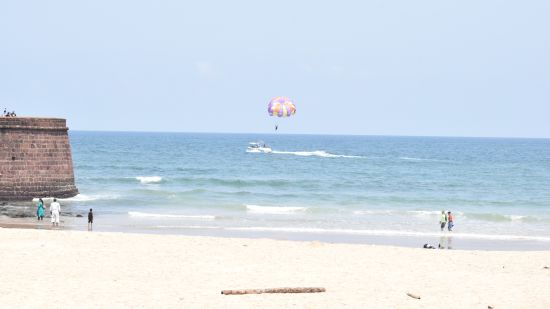 Visitors doing adventure activities at a beach near the fort 