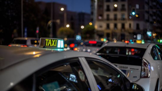 Taxis on the road at night