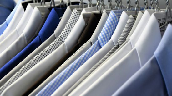 An array of shirts placed on hangers