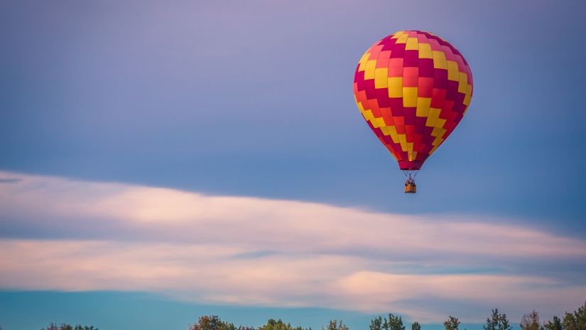 A hot air balloon ride cruising through the sky